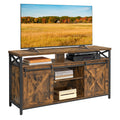 VASAGLE Rustic Brown and Black TV stand with sliding barn-style doors and center shelves; television and display props are not included